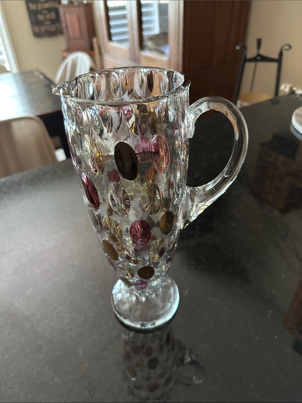 Vintage glass pitcher that stands 12 “ tall